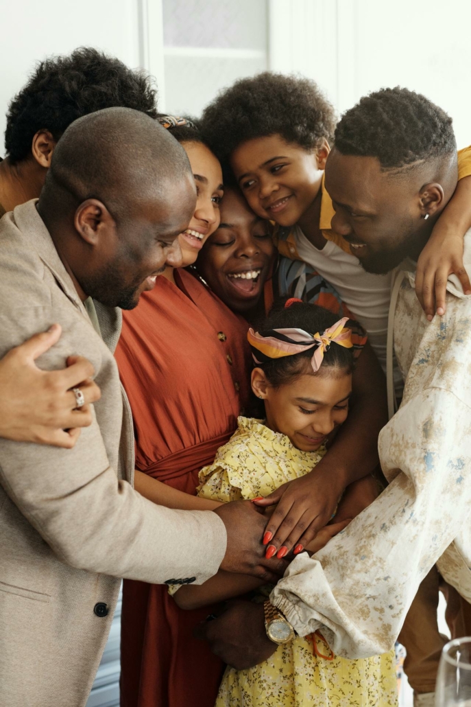 A family embraces a group hug.