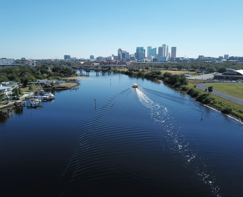 A boat is in the waterway close to the city of Tampa, Florida.